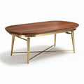 Table basse ovale en bois de noyer avec pieds en métal doré dimensions 120 x 70 x 40cm